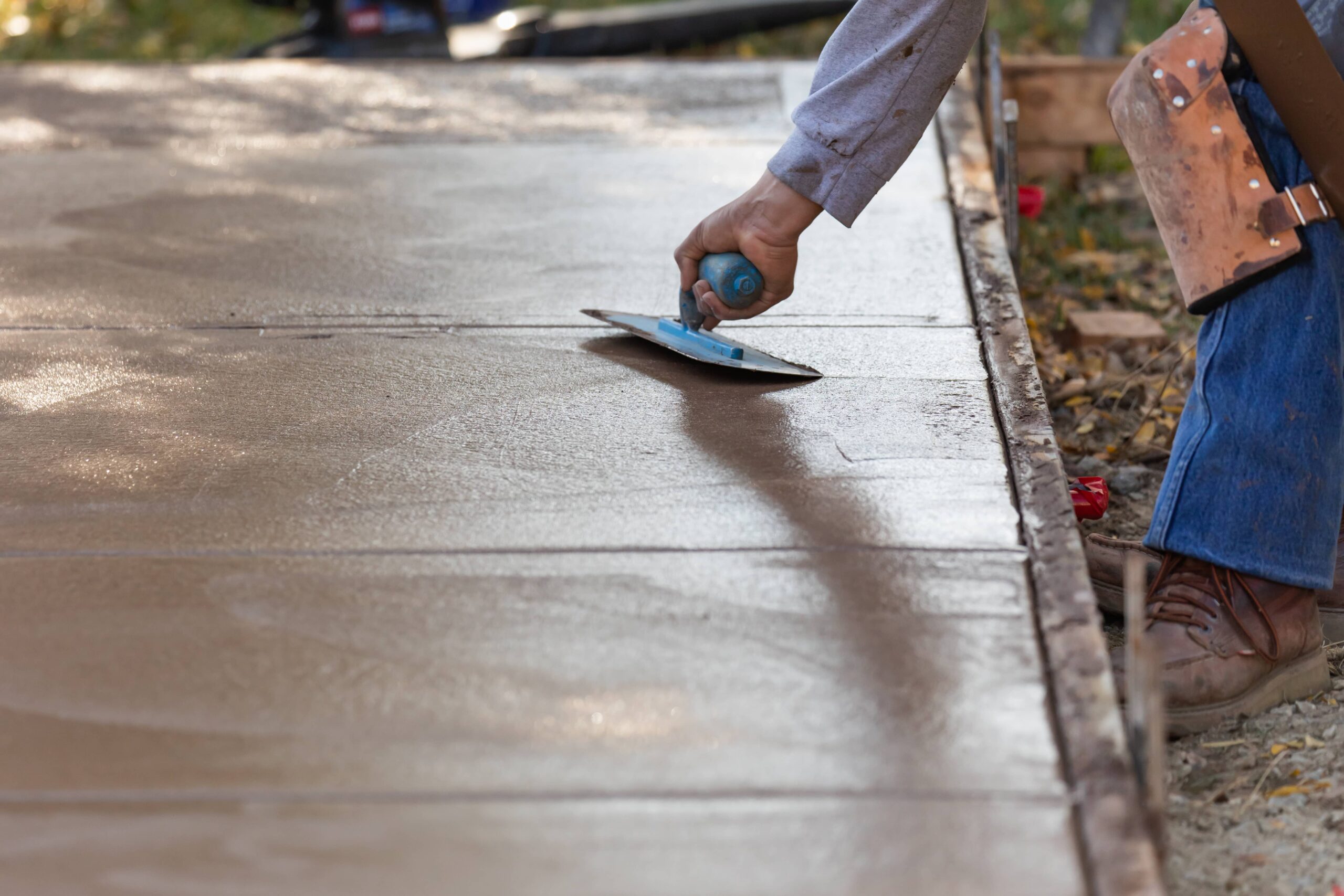 worker smoothing wet cement
