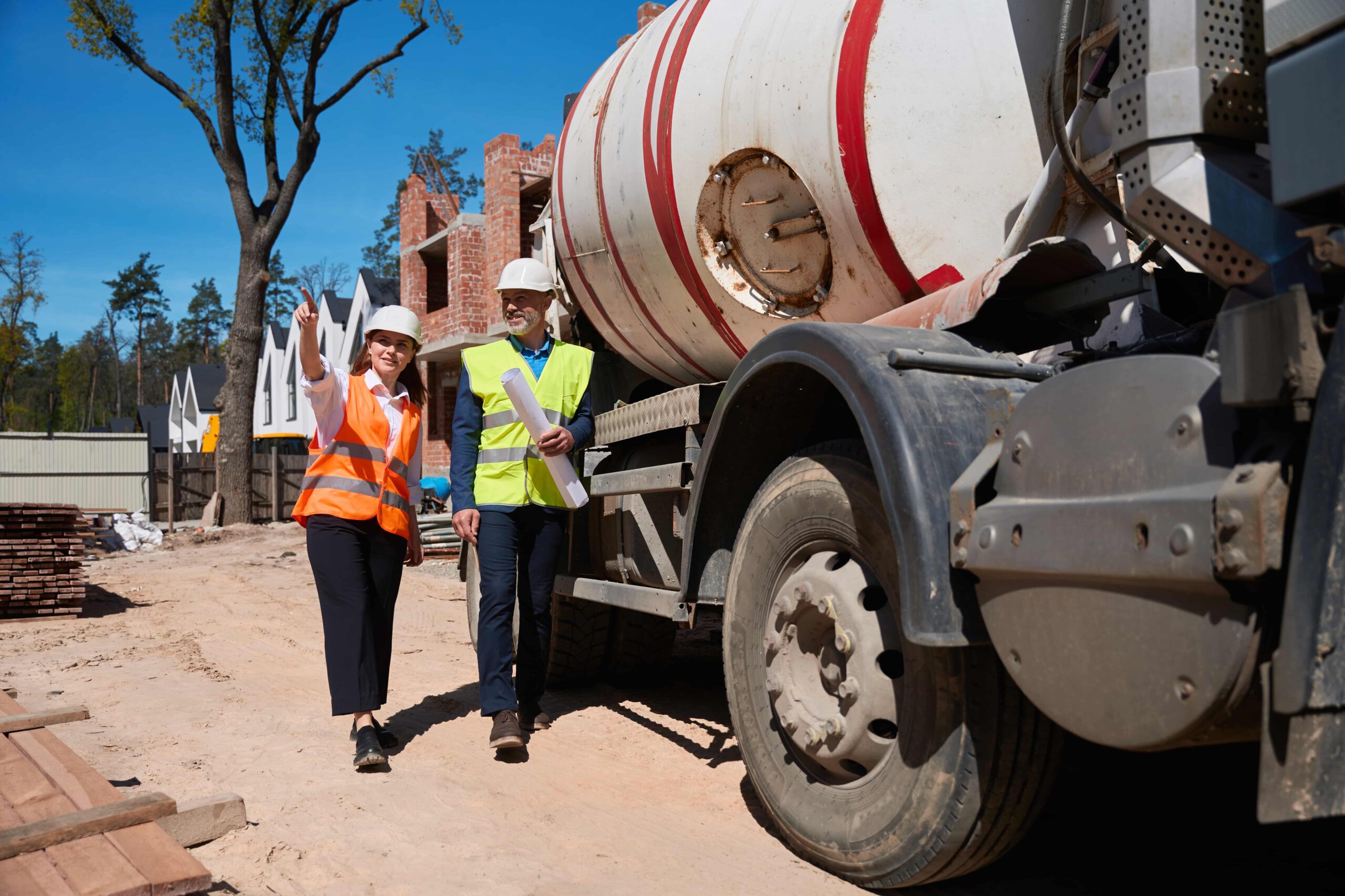 construction worker having concrete delivered